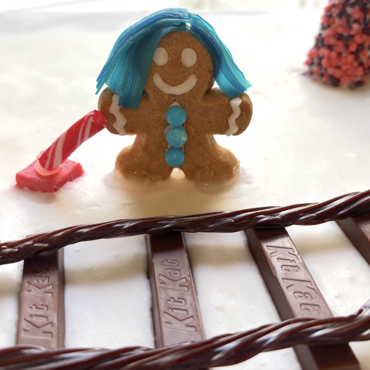 a gingerbread man with blue hair